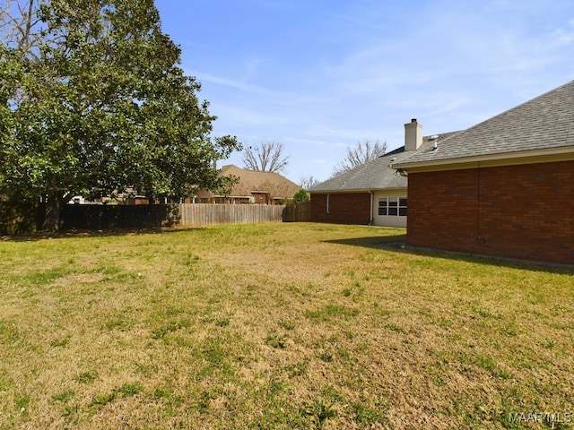 view of yard featuring fence