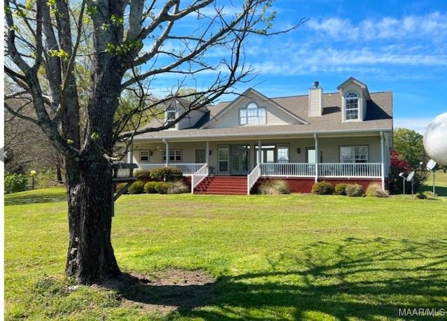 view of front of home featuring covered porch and a front lawn