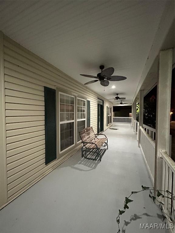 view of patio / terrace with ceiling fan and a porch