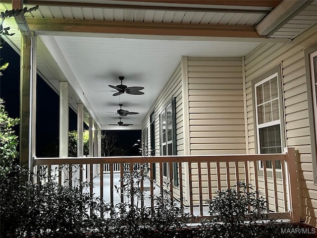 exterior space with a porch and a ceiling fan