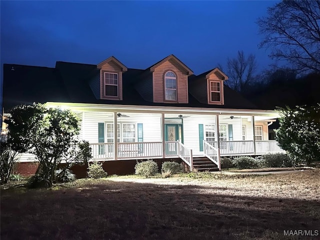 cape cod-style house with a porch