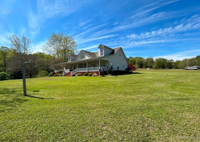 view of property exterior featuring covered porch and a yard