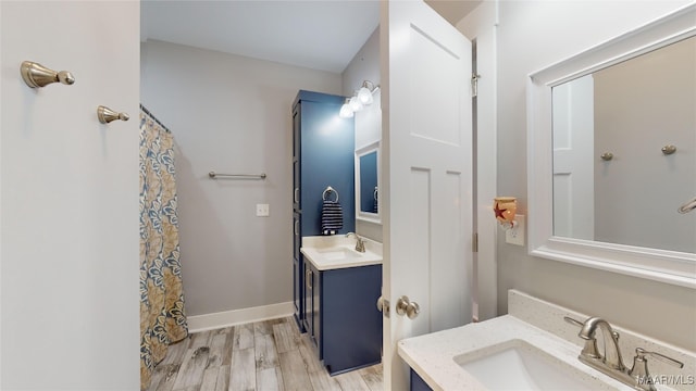 bathroom with hardwood / wood-style flooring and vanity