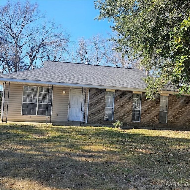 ranch-style house with a front lawn