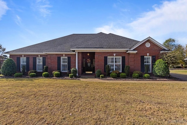 single story home featuring a front yard