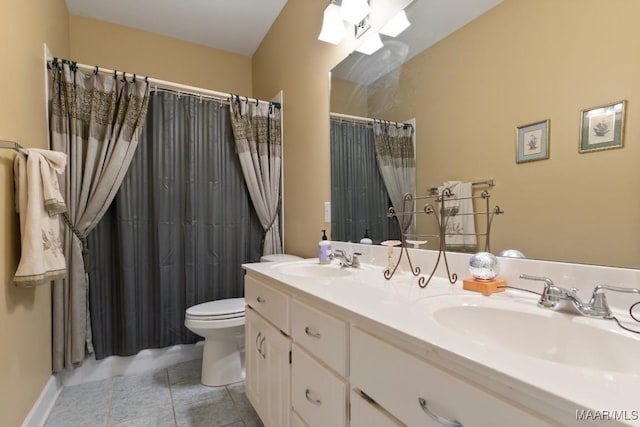 bathroom featuring a shower with curtain, vanity, tile patterned floors, and toilet