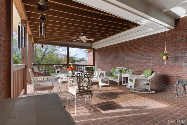 view of patio with ceiling fan, outdoor lounge area, and a deck