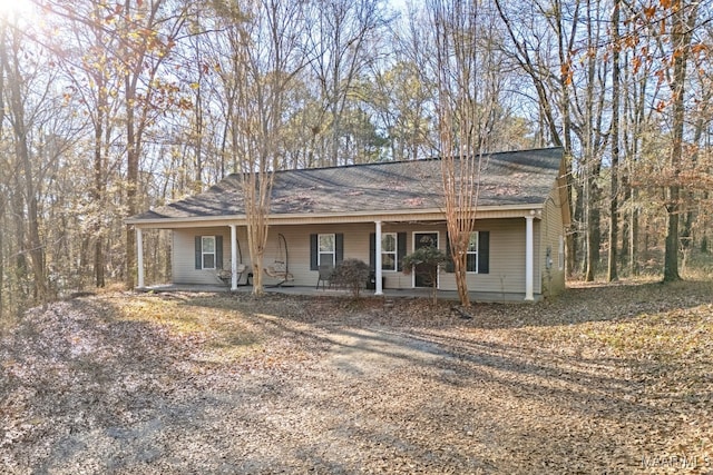 single story home with a porch