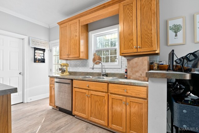 kitchen featuring sink, crown molding, stainless steel dishwasher, light hardwood / wood-style floors, and backsplash