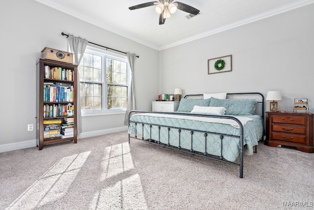 carpeted bedroom featuring ornamental molding and ceiling fan