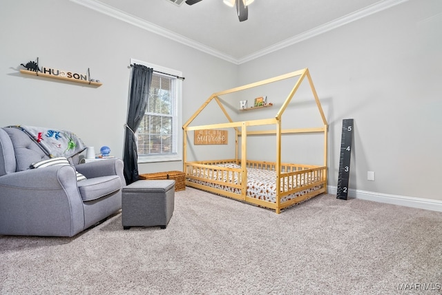 bedroom featuring ornamental molding, ceiling fan, and carpet flooring