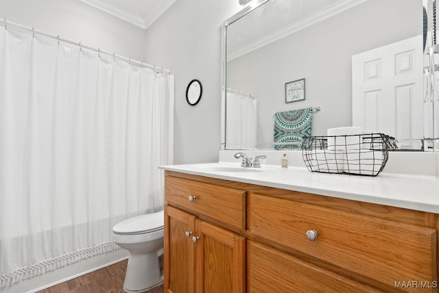 bathroom with vanity, hardwood / wood-style flooring, ornamental molding, and toilet