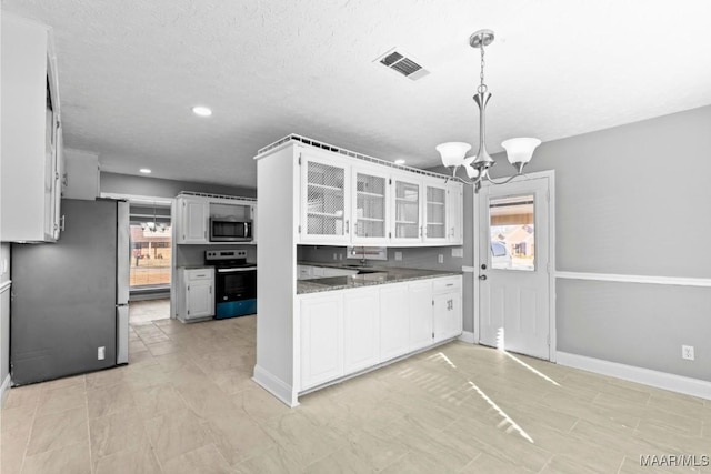 kitchen with stone counters, a notable chandelier, pendant lighting, stainless steel appliances, and white cabinets