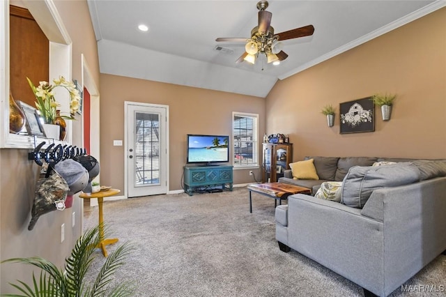 living room with lofted ceiling, crown molding, ceiling fan, and carpet flooring