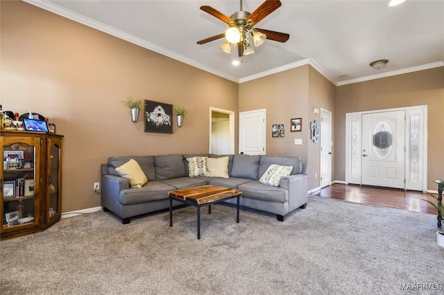 living room with crown molding, a towering ceiling, ceiling fan, and carpet flooring