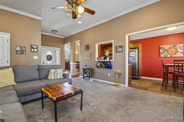 carpeted living room featuring baseboards, crown molding, and a ceiling fan
