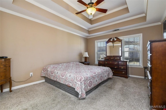 bedroom with ceiling fan, a tray ceiling, and light colored carpet