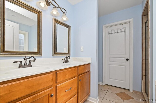 bathroom featuring vanity, tile patterned floors, and a shower with shower door