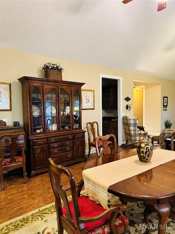 dining room featuring light hardwood / wood-style flooring and ceiling fan