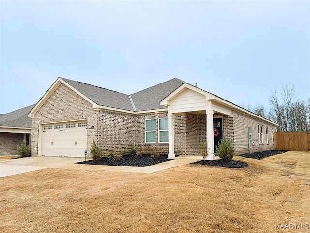 view of front facade with a garage and a front lawn