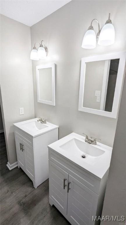 bathroom with hardwood / wood-style flooring and vanity