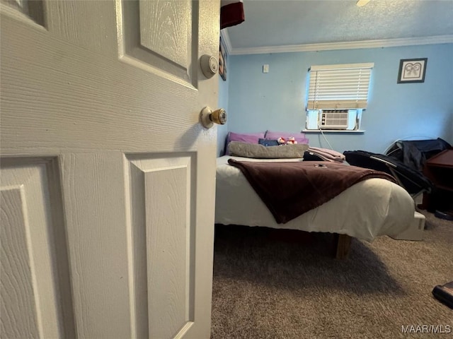 carpeted bedroom featuring cooling unit, crown molding, and ceiling fan