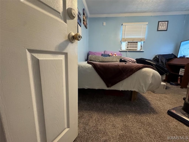 bedroom with cooling unit, ornamental molding, and carpet flooring