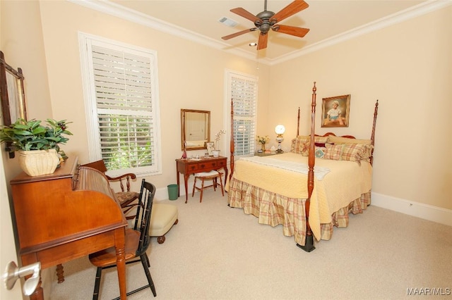 carpeted bedroom featuring ornamental molding and ceiling fan