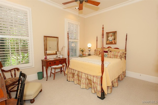 carpeted bedroom with ornamental molding and ceiling fan