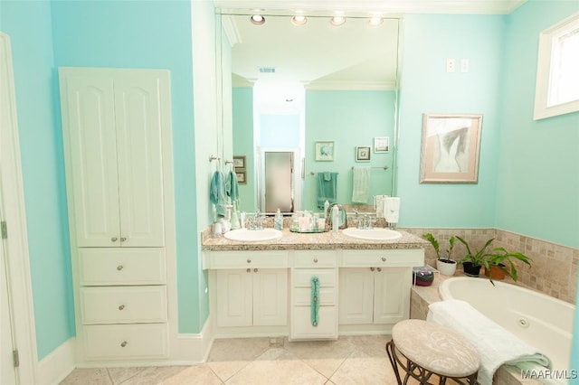 bathroom with tile patterned flooring, crown molding, a washtub, and vanity