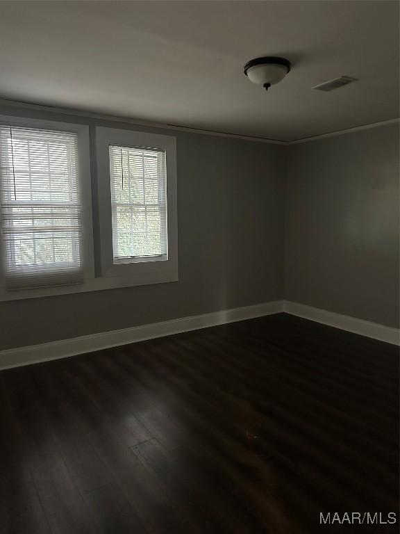 spare room featuring hardwood / wood-style floors