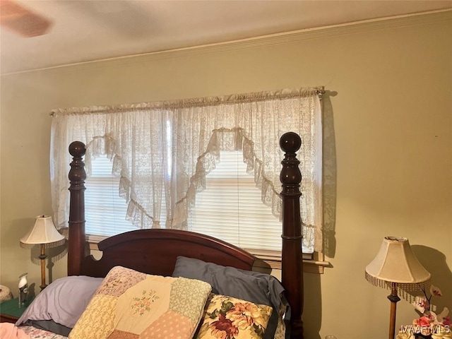 bedroom featuring crown molding