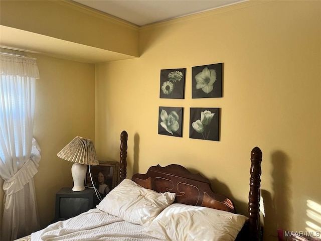 bedroom featuring crown molding