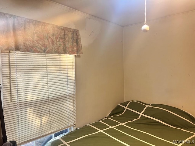 unfurnished bedroom featuring crown molding