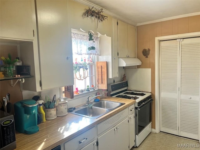 kitchen with white cabinetry, white range with gas cooktop, light tile patterned flooring, and sink