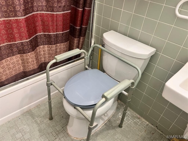 bathroom with tile walls