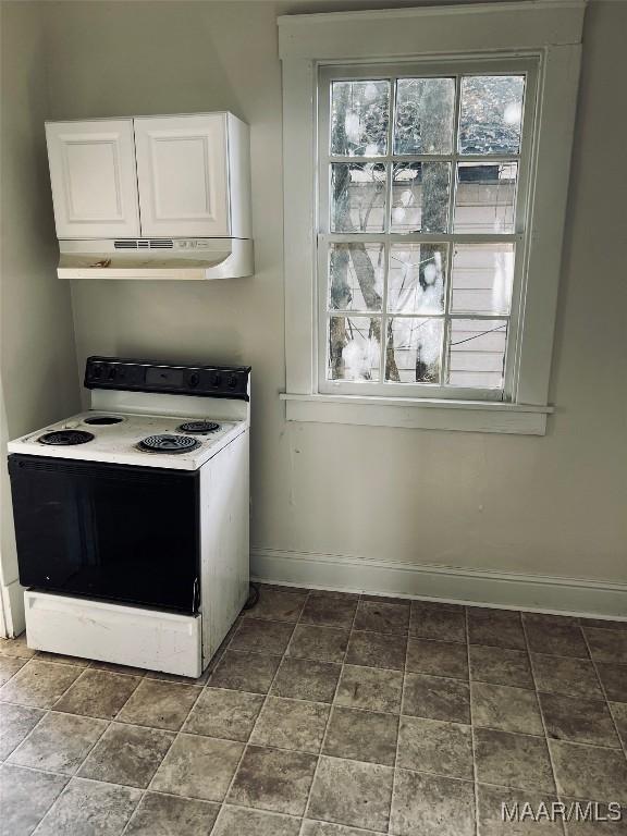 kitchen featuring white cabinetry and white range with electric stovetop