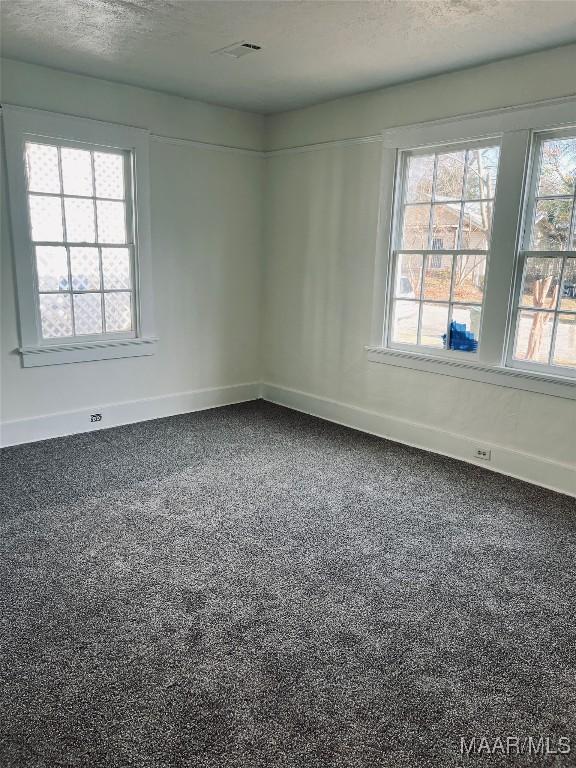 empty room with a textured ceiling