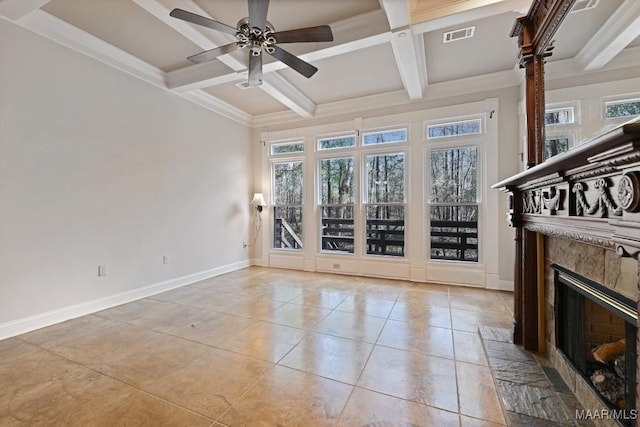 unfurnished living room featuring a ceiling fan, light tile patterned flooring, a fireplace, coffered ceiling, and beam ceiling