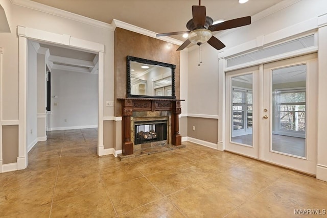 unfurnished living room with tile patterned floors, a ceiling fan, and ornamental molding