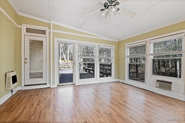 unfurnished sunroom with heating unit