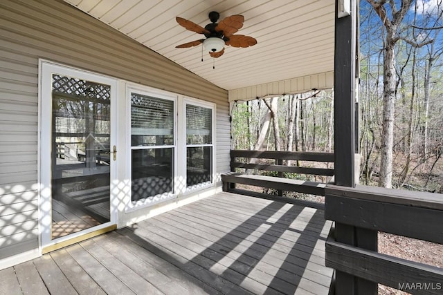 wooden deck with a ceiling fan