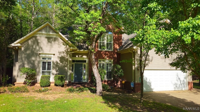 view of front of home featuring aphalt driveway and a garage