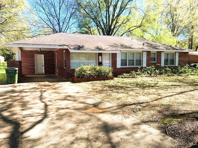 ranch-style home featuring a carport