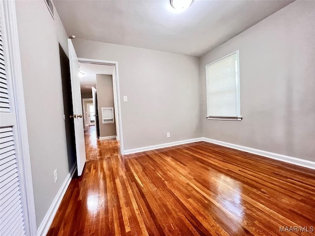 unfurnished bedroom featuring wood-type flooring