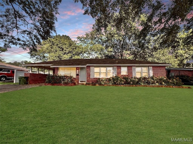 ranch-style house with a lawn