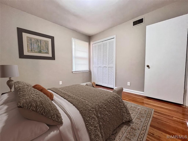 bedroom with hardwood / wood-style floors