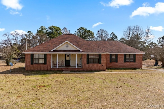 single story home featuring a front lawn and covered porch