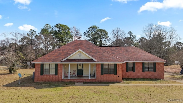 view of front of house with a porch and a front yard