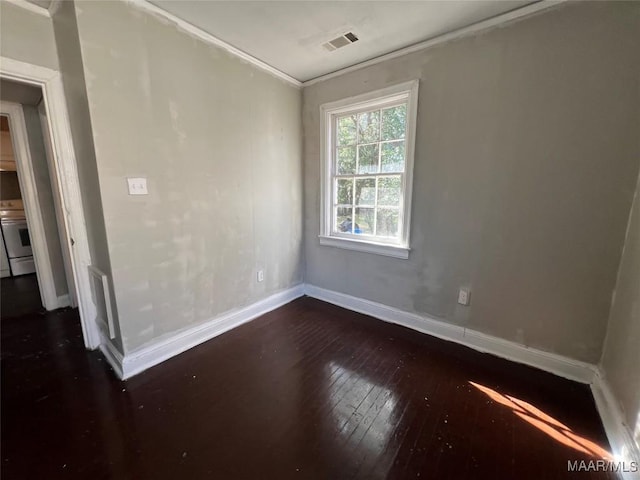 unfurnished room featuring dark hardwood / wood-style flooring and ornamental molding